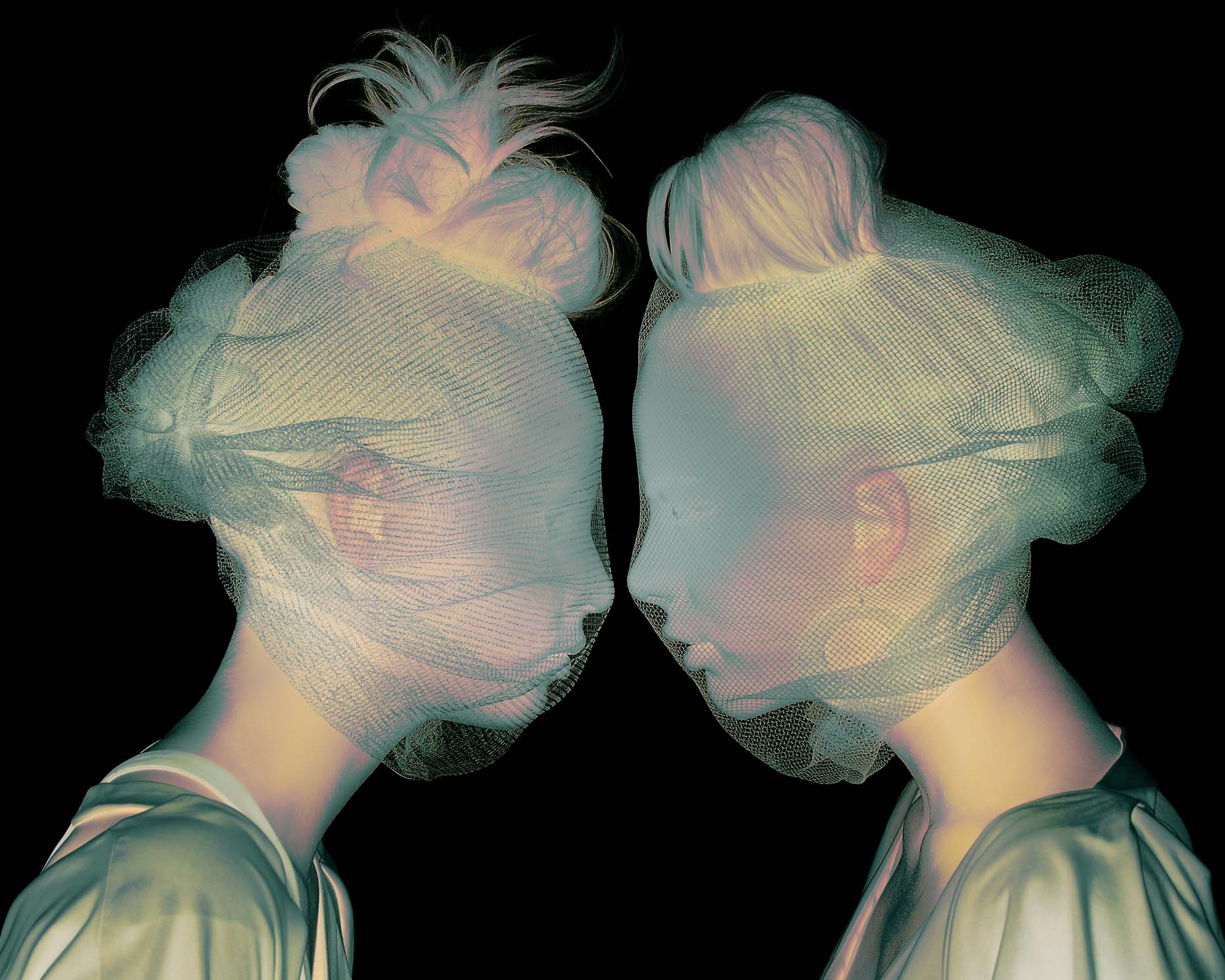 Solarized photo of two women looking directly at each other photographed by Marc Rogoff