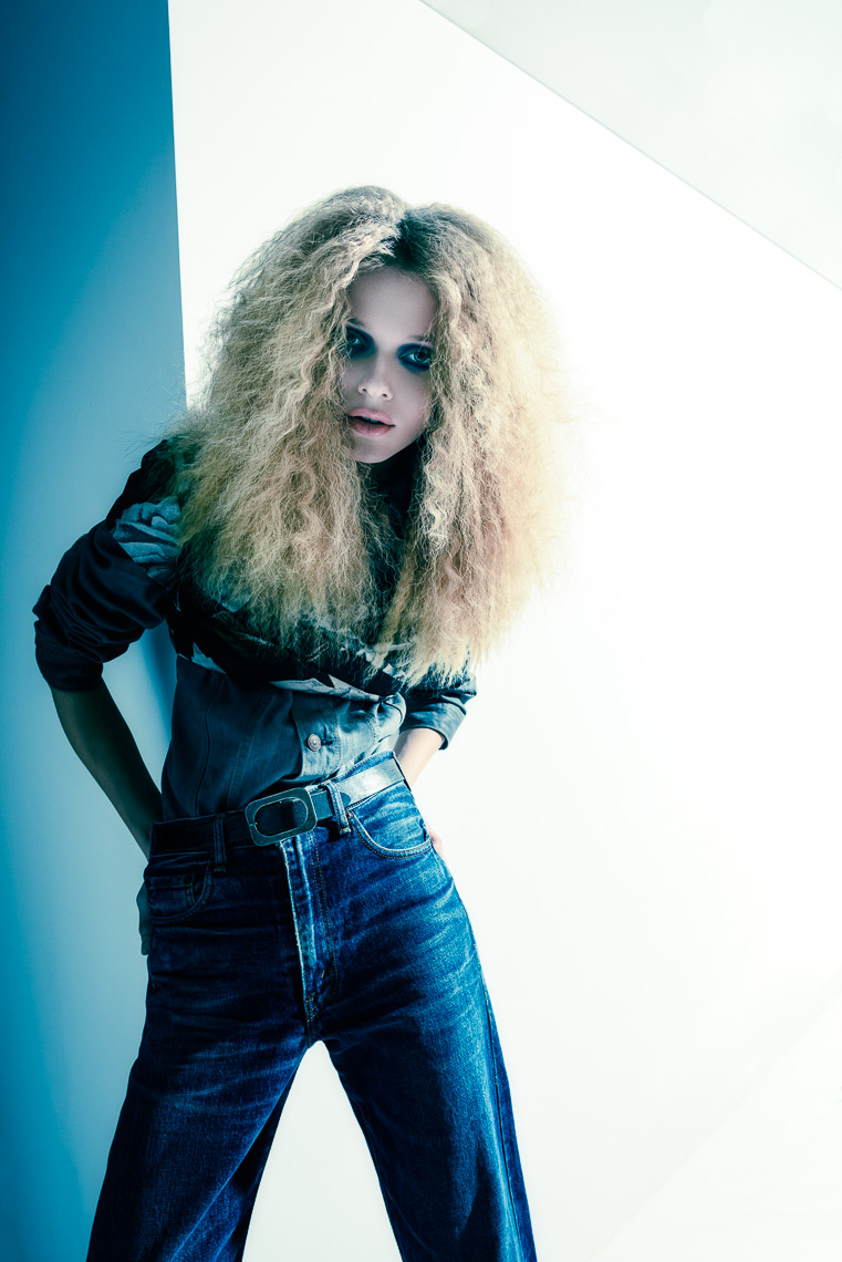 Blond haired female model in denim jeans photographed by Marc Rogoff